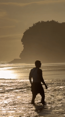 Morning beach walk captured at sunrise in Selemadeg, Indonesia