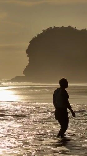 Morning beach walk captured at sunrise in Selemadeg, Indonesia