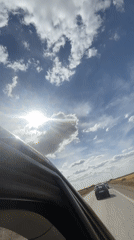 Vehicle passenger records sunny afternoon drive in Morocco
