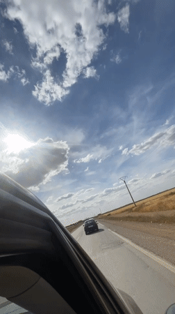 Vehicle passenger records sunny afternoon drive in Morocco