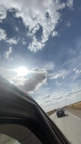 Vehicle passenger records sunny afternoon drive in Morocco