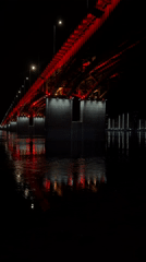 Red-lit Vinogradovsky Bridge captured by witnesses in Krasnoyarsk