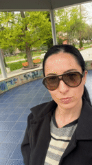 Woman films selfies at monument in Pleven, Bulgaria