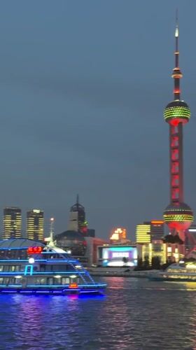 Tourists photograph Shanghai skyline from Bund waterfront Sunday morning