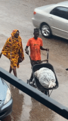 Bukuru streets stay busy through a rainy midday