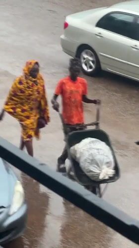Bukuru streets stay busy through a rainy midday