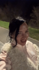 Woman performs on sidewalk in Sarapul, Russia