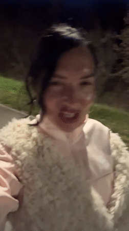 Woman performs on sidewalk in Sarapul, Russia