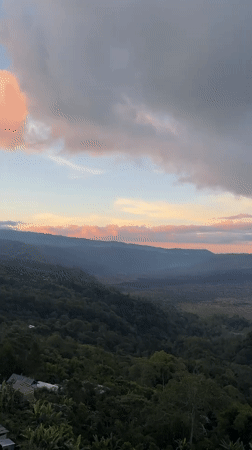 Tourists capture sunrise views at Mount Batur overlooks