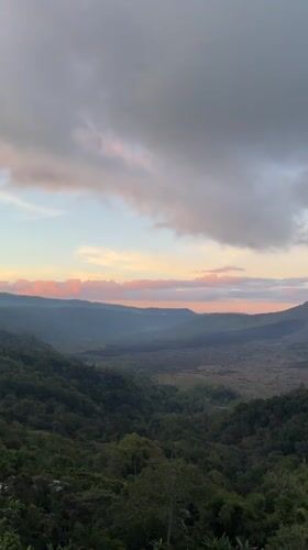 Tourists capture sunrise views at Mount Batur overlooks