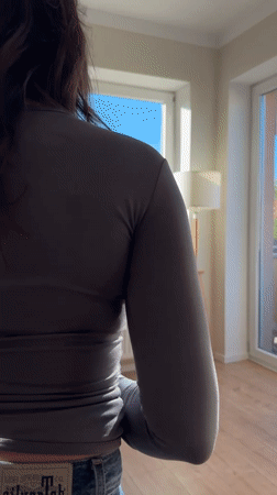 Young woman photographed in casual indoor session, Budapest