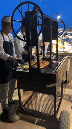 Beach food vendors operate illuminated carts in Denpasar