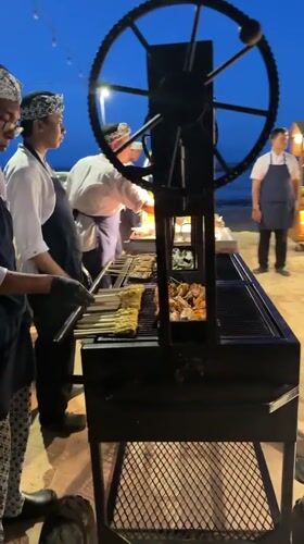 Beach food vendors operate illuminated carts in Denpasar