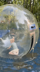 Children play in water walking balls at Izhevsk park