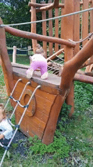 Kids play on a ship-shaped wooden playground in Sokolov