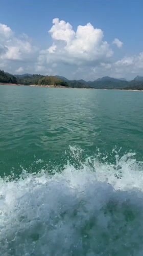 Green lake waters with foamy waves observed in Thailand