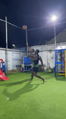 Nighttime basketball game played on artificial turf in Akwanga
