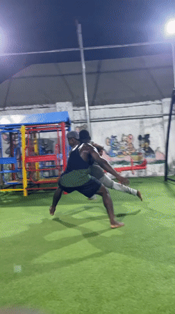 Nighttime basketball game played on artificial turf in Akwanga