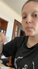 Person enjoys desk snacks during work break in Gijón
