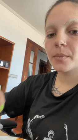 Person enjoys desk snacks during work break in Gijón