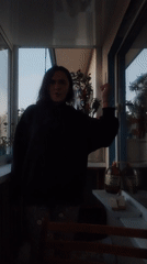 Young woman's evening activities captured on Yekaterinburg balcony