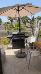 Sun-drenched patio with mountain views in Mogán, Spain
