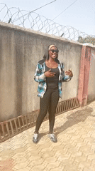 Woman photographed in courtyard in Rido, Nigeria