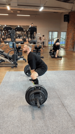 Man performs deadlift at gym in Chaykovsky, Russia