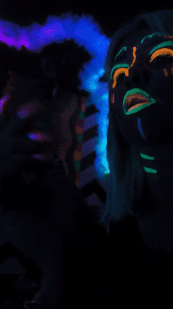 Artist Creates Glowing Body Art Under Blacklight in Noviy