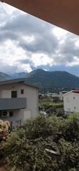 Morning panoramic video captures residential Bar, Montenegro with mountain backdrop