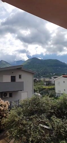 Morning panoramic video captures residential Bar, Montenegro with mountain backdrop