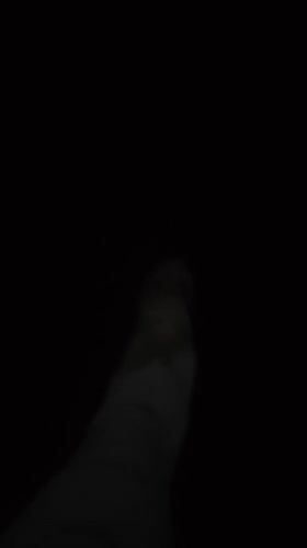 Person walks through dark alley in Chongqing tech district