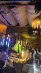 Restaurant nightclub celebration with live music and sparklers captured