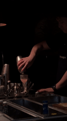 Bartender prepares cocktails at Seoul bar during morning hours