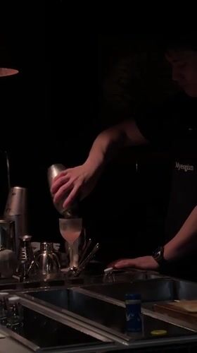Bartender prepares cocktails at Seoul bar during morning hours