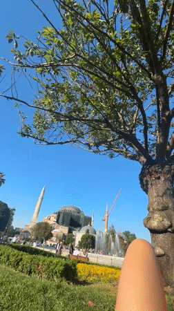 Woman enjoys sunny afternoon at Istanbul's Sultanahmet Park