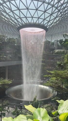 Indoor waterfall filmed in glass-domed Singapore structure