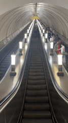 Crowded escalator tunnel captured in Saint Petersburg metro station