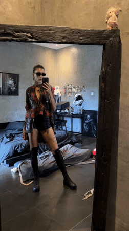 Woman takes mirror selfie in Mengwi, Indonesia