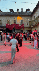 Evening courtyard event in Milan with YOOX branding