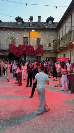 Evening courtyard event in Milan with YOOX branding