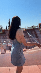 Women pose for photos at Krasnodar fountain plaza