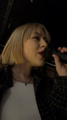 Woman performs with microphone in Budva, Montenegro