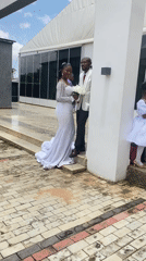 Wedding party photographs outside a modern building in Bukuru, Nigeria