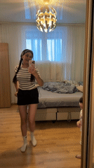 Mirror selfies and candid moments in a teal-walled bedroom