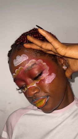 Artistic face paint session and nighttime street activity documented in Ado