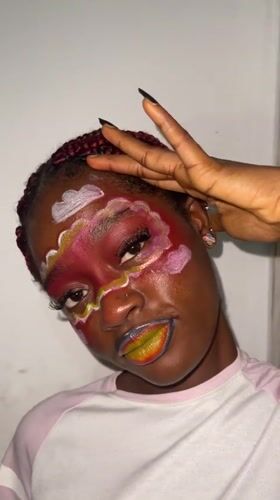 Artistic face paint session and nighttime street activity documented in Ado