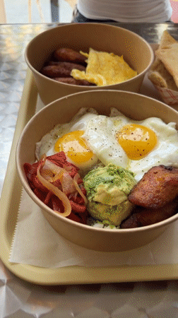Savory breakfast bowls with eggs, plantains, and avocado in New York