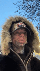 Tattooed figure in fur-lined jacket on Buenos Aires sidewalk