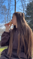Mother and child enjoy ice cream outing in Russian countryside